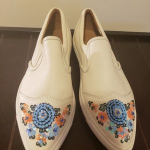 Never worn Coach pointed toe slip on sneakers